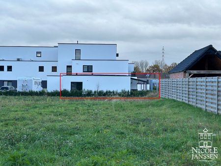 Mooi gelijkvloers nieuwbouwappartement met terras, ondergrondse autostaanplaats en kelderberging - Photo 4