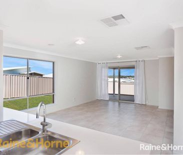 FAMILY HOME IN BOOROOMA - Photo 1