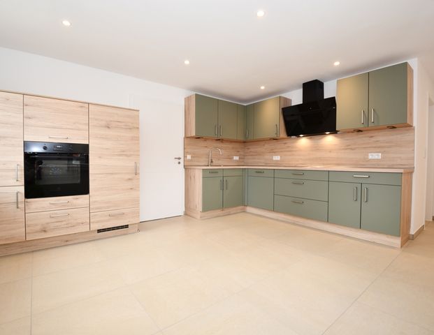 Wohnen mit Wohlfühlcharakter - Mietwohnung mit Balkon, Einbauküche und E-Ladestation in Altenoythe - Photo 1