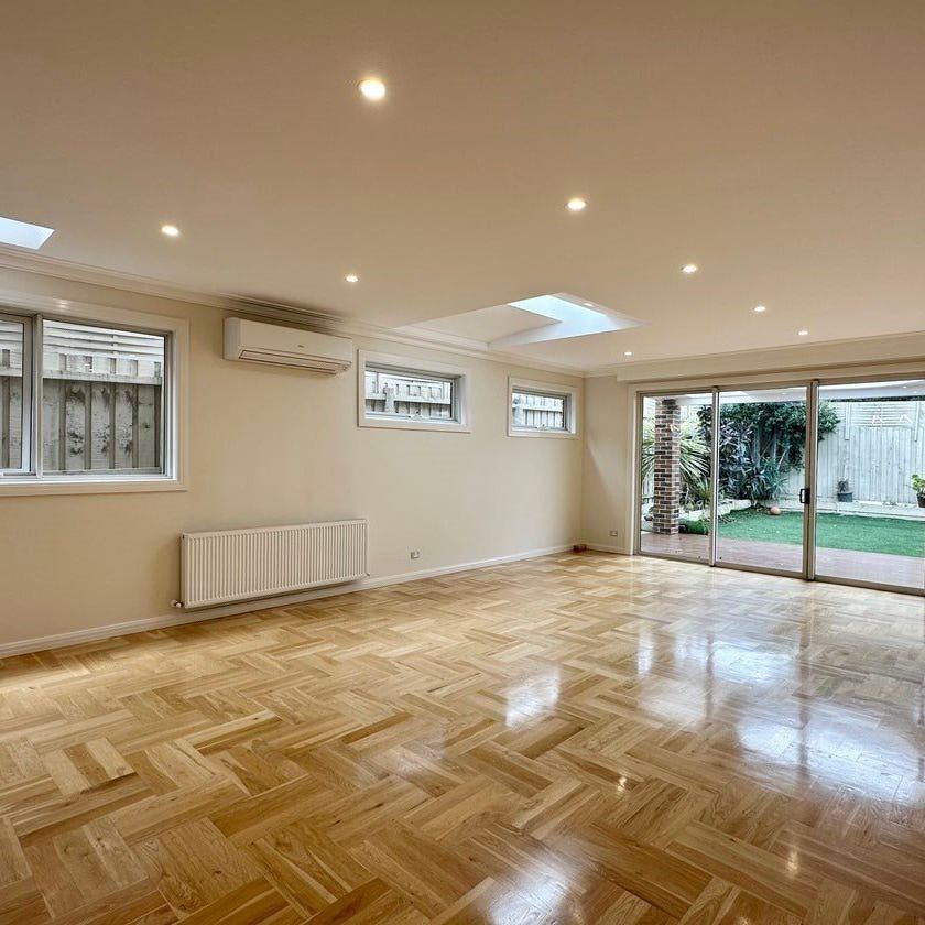 ARCHITECTURALLY DESIGNED TOWNHOUSE IN THE MCKINNON SCHOOL ZONE - Photo 1