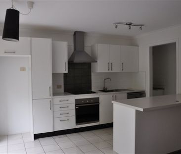 This comfortable 2-bedroom townhouse is in a perfect location - Photo 1