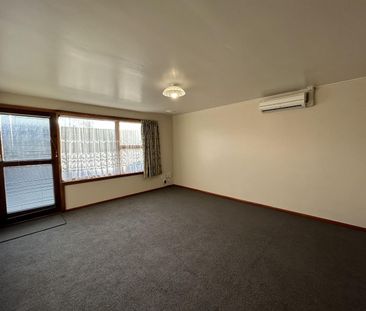 Two Bedroom Unit with Private Garden and Garage! - Photo 1