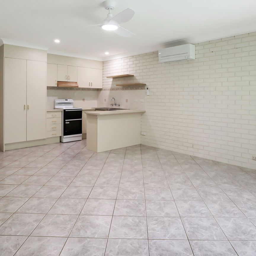Light-Filled Coastal Unit in Convenient Location - Photo 1