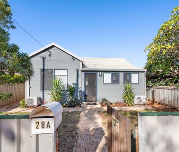 Introducing this charming, renovated three-bedroom, one-bathroom ch... - Photo 1