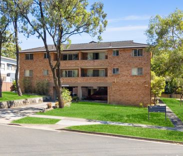 First-Floor Full Brick Two-Bedroom Unit with Single Garage! - Photo 5