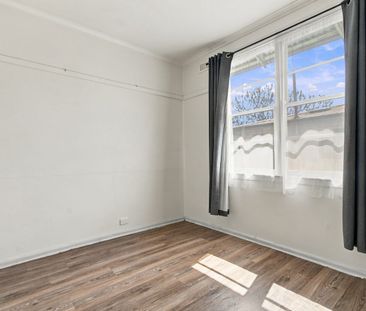 Three-Bedroom Home with Fresh Flooring and Spacious Backyard - Photo 2