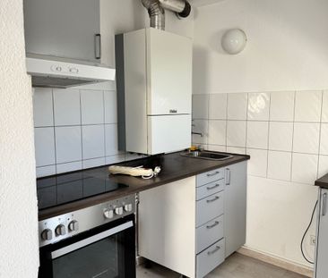 Gemütliche Dachgeschosswohnung mit Einbauküche! - Foto 3
