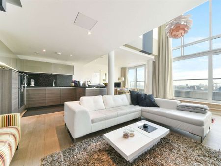 Presenting this large duplex two bed, two bath apartment with spectacular views of Canary Wharf in the popular Baltimore wharf development. - Photo 2