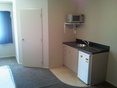 This large, self contained studio room wont last long. - Photo 3