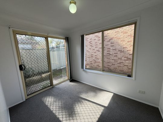 Well-Located 3 Bedroom Townhouse with Lock-Up Garage - Photo 1