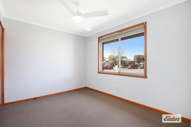 Charming 3-Bedroom Home with Modern Comforts & Outdoor Storage - Photo 1