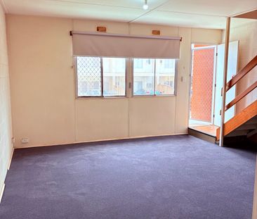 Two-storey, two-bedroom unit - Photo 1