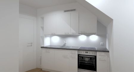 Appartement mansardé dans un immeuble ancien dans un emplacement de choix - Photo 4