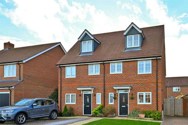 Situated in a peaceful location with open green space to the front, this spacious family home is arranged over three floors and offers well-presented accommodation throughout. - Photo 1