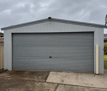 VERSATILE GARAGE & WORKSHOP SPACE – FUNCTIONALITY MEETS FAMILY LIVING - Photo 6