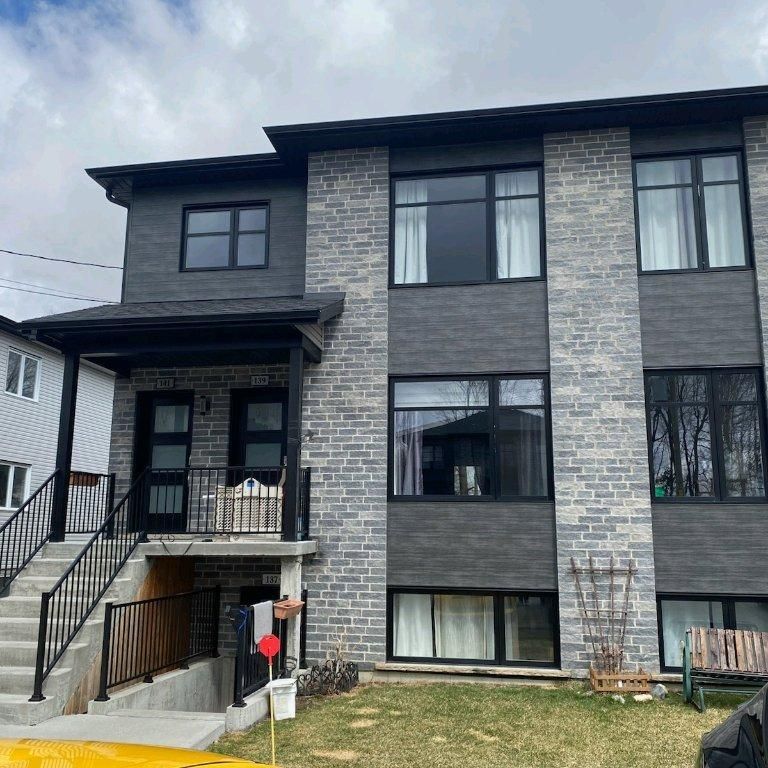 Grand 5 1/2 dans un immeuble de 2019 à Farnham et petits chiens acceptés - Photo 1