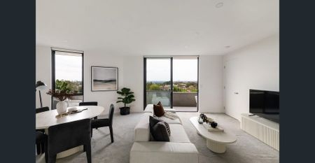 Sleek Top-Floor Sanctuary With City Skyline Vistas - Photo 2
