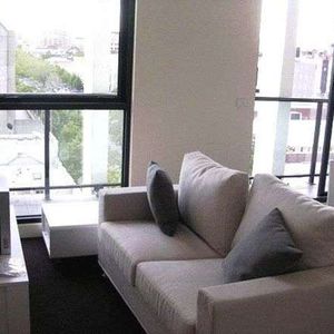 Furnished 2-Bedroom Apartment in Prime Melbourne CBD Location - Photo 2