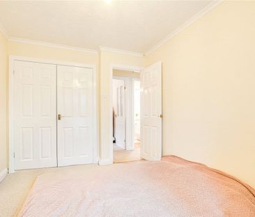 A 2 bedroom detached bungalow with a garage and driveway parking in... - Photo 4