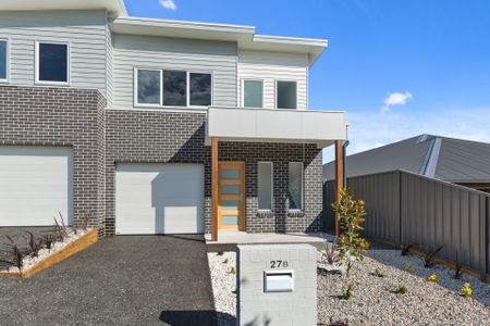 Modern 3-Bedroom Duplex Offering Style and Low-Maintenance Living! - Photo 3