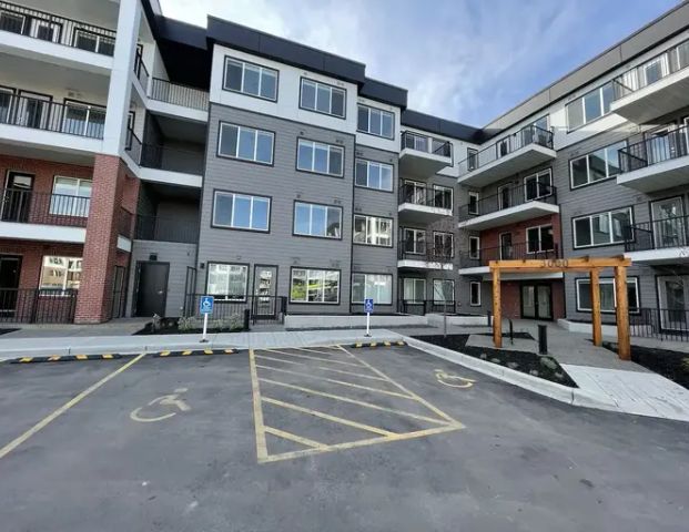 Brand New 2 Bed/2 Bath Condo in Wolf Hollow | 111 Wolf Creek Drive Southeast, Calgary - Photo 1