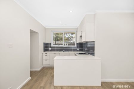 Conveniently positioned modern two bedroom unit with lock up garage - Photo 5