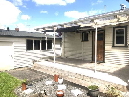 This is a well presented two bedroom home set on an easy care section with a fenced rear yard. - Photo 2