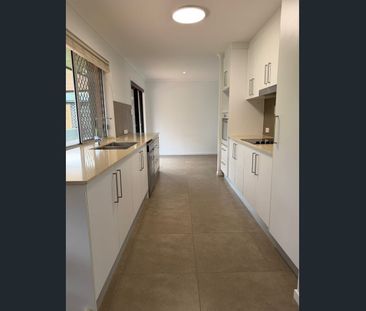 Modern Family Home in Ashmore With A Pool - Photo 1