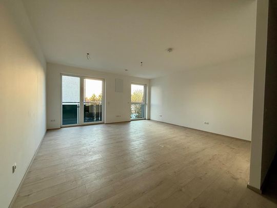 Bester Energiestandard! Moderne 1-Zi-Wohnung mit Balkon und Küche - KFW 40 NH - Photo 1