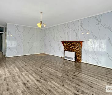 THREE-BEDROOM HOME WITH GARAGE - Photo 2