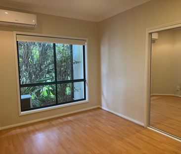 Family Friendly Four Bedroom Home located in Robina with Security Gate - Photo 5