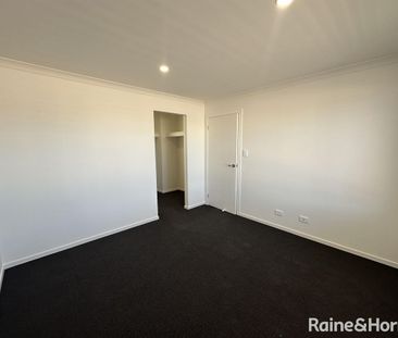 Modern Family Living in the Heart of Munno Para Downs - Photo 2