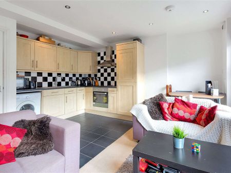 This well-proportioned three bedroom apartment is set over two floors creating a feeling of space and light. - Photo 2