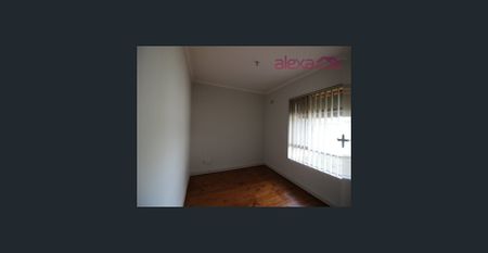 Convenient and Low-Maintenance Living: A Charming 3-Bedroom Brick Home - Photo 4