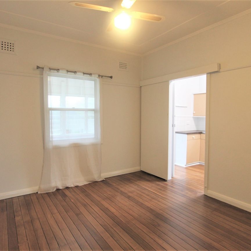 2 Bedroom Home with Sunroom, In A Great Position - Photo 1