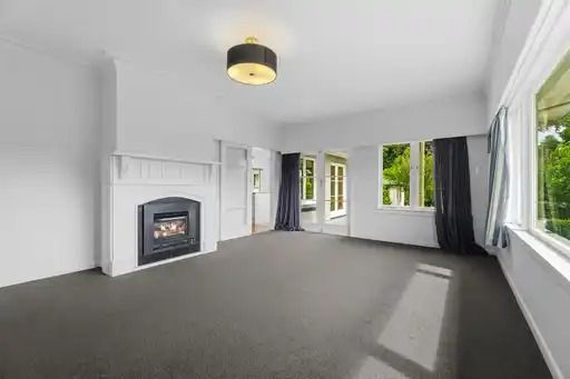 This beautifully presented three-bedroom, two-bathroom home offers a premium standard of living in one of the most desirable locations near the city. - Photo 1