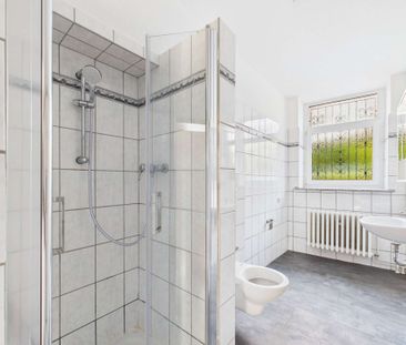 Helle 3-Zimmer Souterrainwohnung mit Balkon in zentraler Wohnlage v... - Foto 1