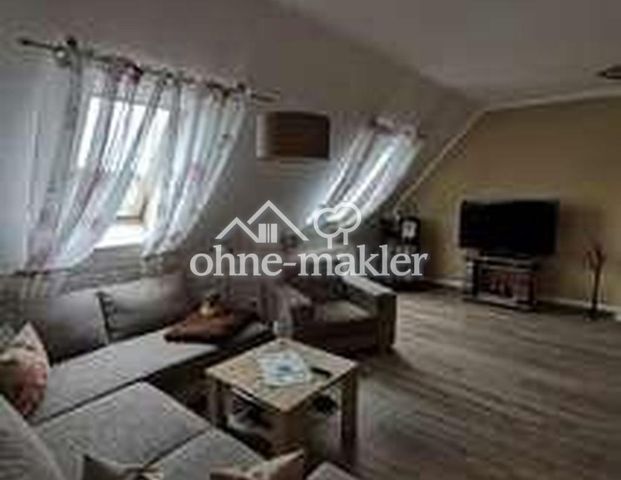 Sonnige 4-Zimmer-DG-Wohnung mit großem Südbalkon, Keller und Garage - Photo 1