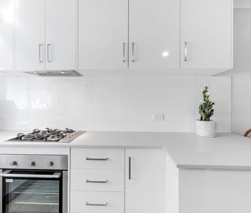 Fully-Renovated, Stylish Two Bedroom Townhouse in a Prime Location! - Photo 1