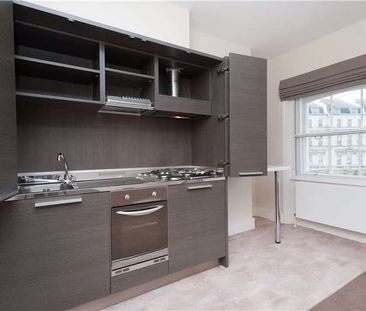 A well located studio flat with its own kitchenette and shared bath... - Photo 1