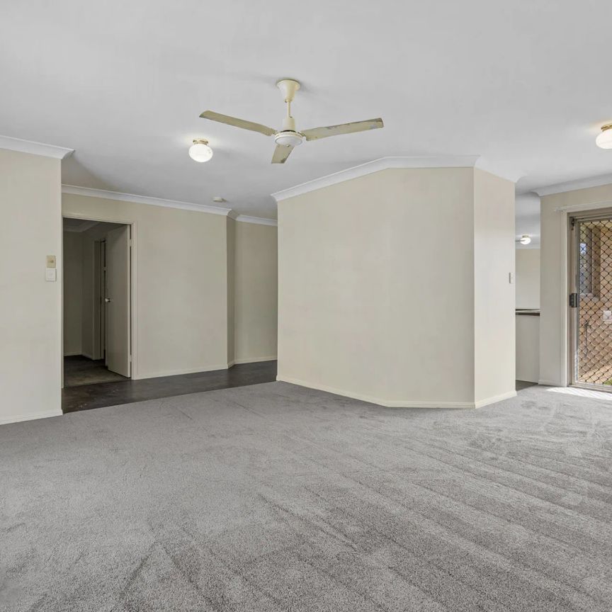 Four bedroom home with air conditioning on large block.. - Photo 1