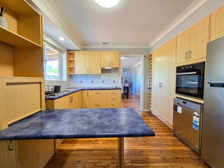 Spacious Family Home with Drive-Through Parking & Outdoor Entertaining - Photo 5