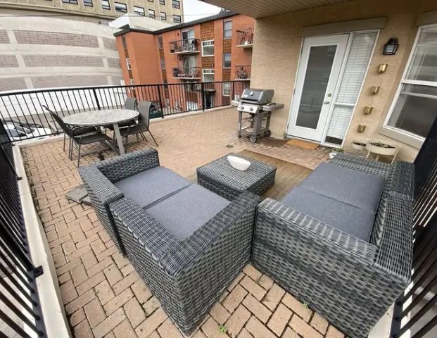 Sunny Corner Suite with Huge Patio | 323 18 Ave SW, Calgary - Photo 1