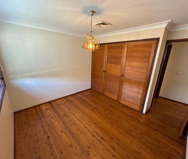 Spacious Family Home with Multiple Living Areas & Water Included - Photo 6