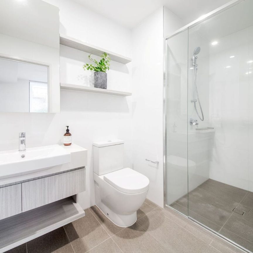 Beautiful Apartment with Sunny North-East-facing Balcony in the Heart of Spring Hill! - Photo 1