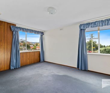 Comfortable 2-Bedroom Living in Convenient New Town - Photo 2