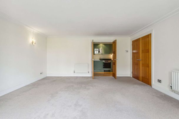 A bright two bedroom apartment with off-street parking in Harrods Village with communal gym and pool facilities - Photo 1