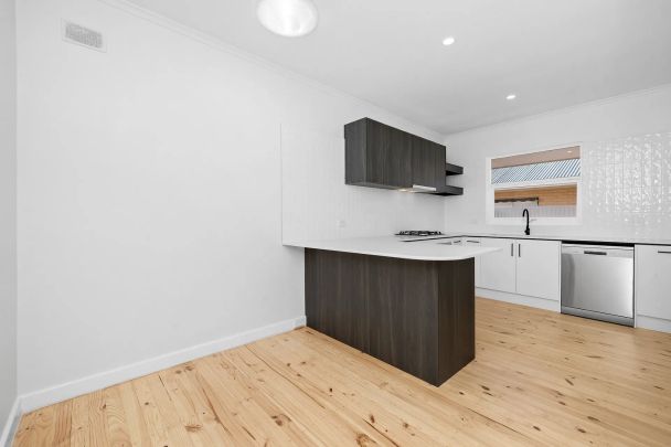 Modern, Fully Renovated Unit in a Convenient Location - Photo 1