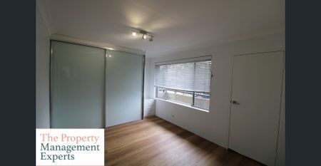 Fresh 2 bedroom apartment with garage! - Photo 3