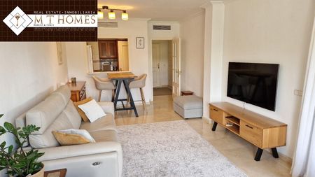 FULLY FURNISHED FRONTLINE GOLF APARTMENT WITH LARGE TERRACE BEAUTIFUL VIEWS - POOL AND A GARAGE - Photo 2